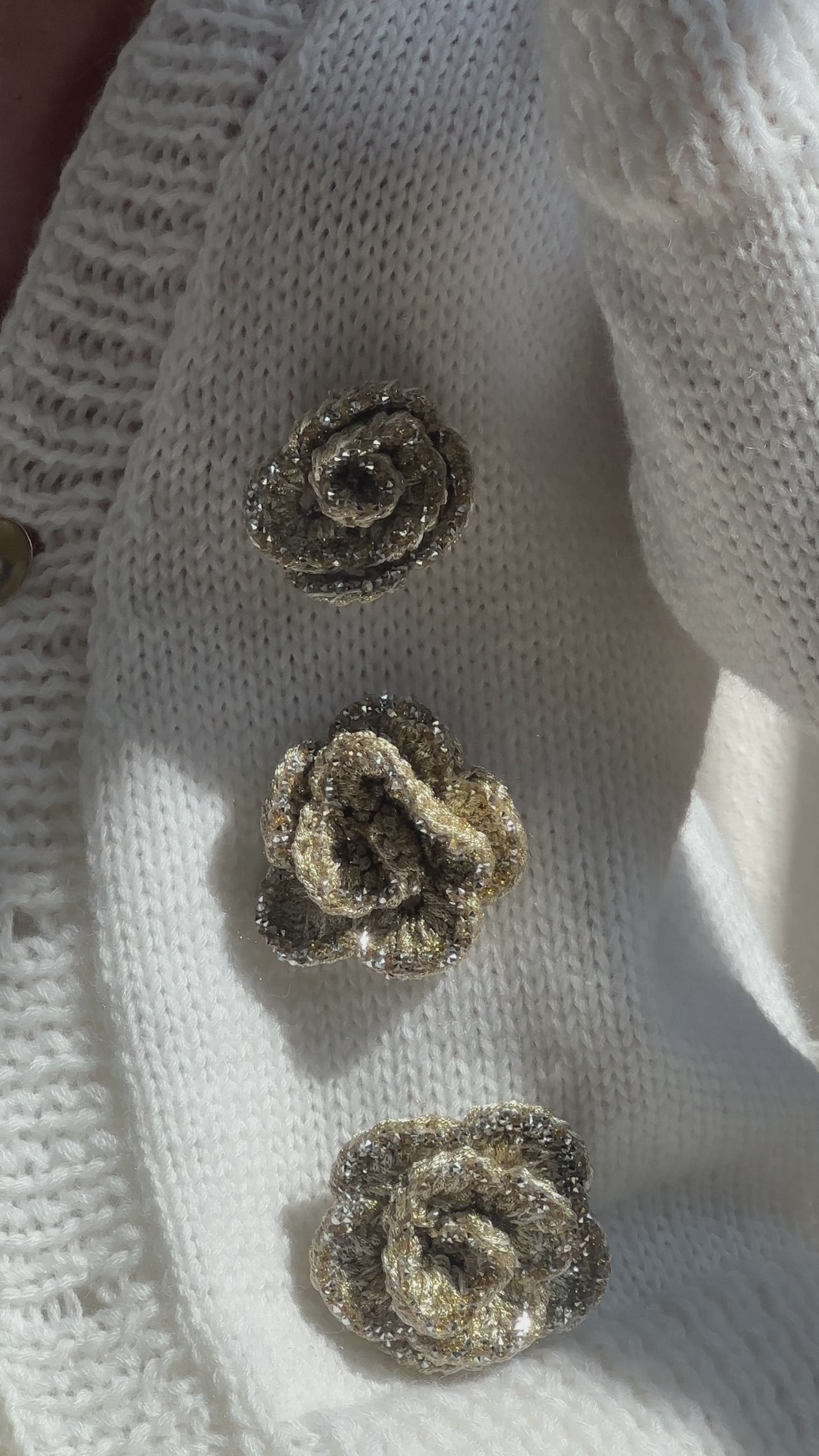 White cardigan with golden roses