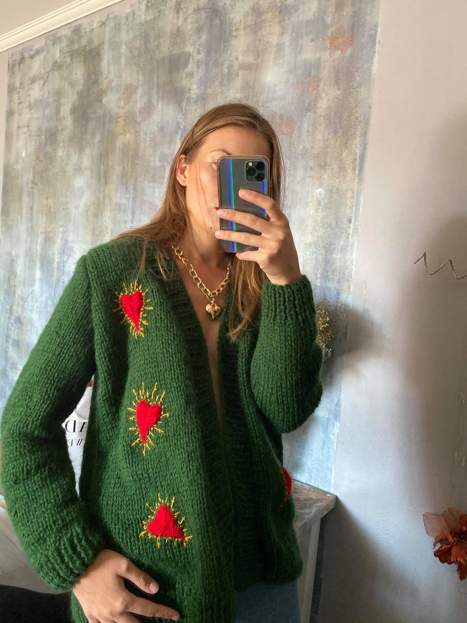 Green wool cardigan with hearts