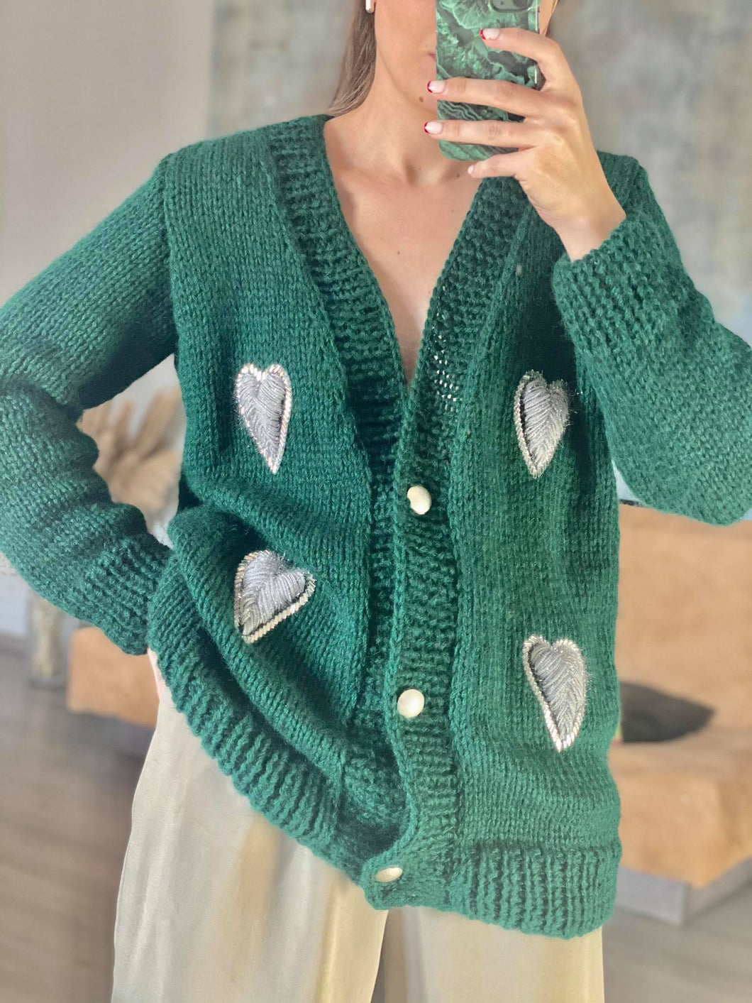 Green cardigan with silver hearts