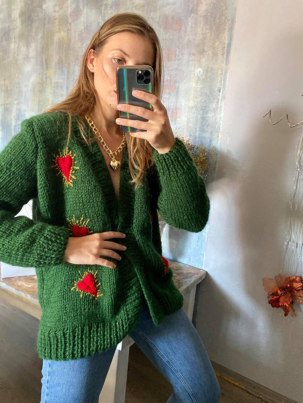Green wool cardigan with hearts