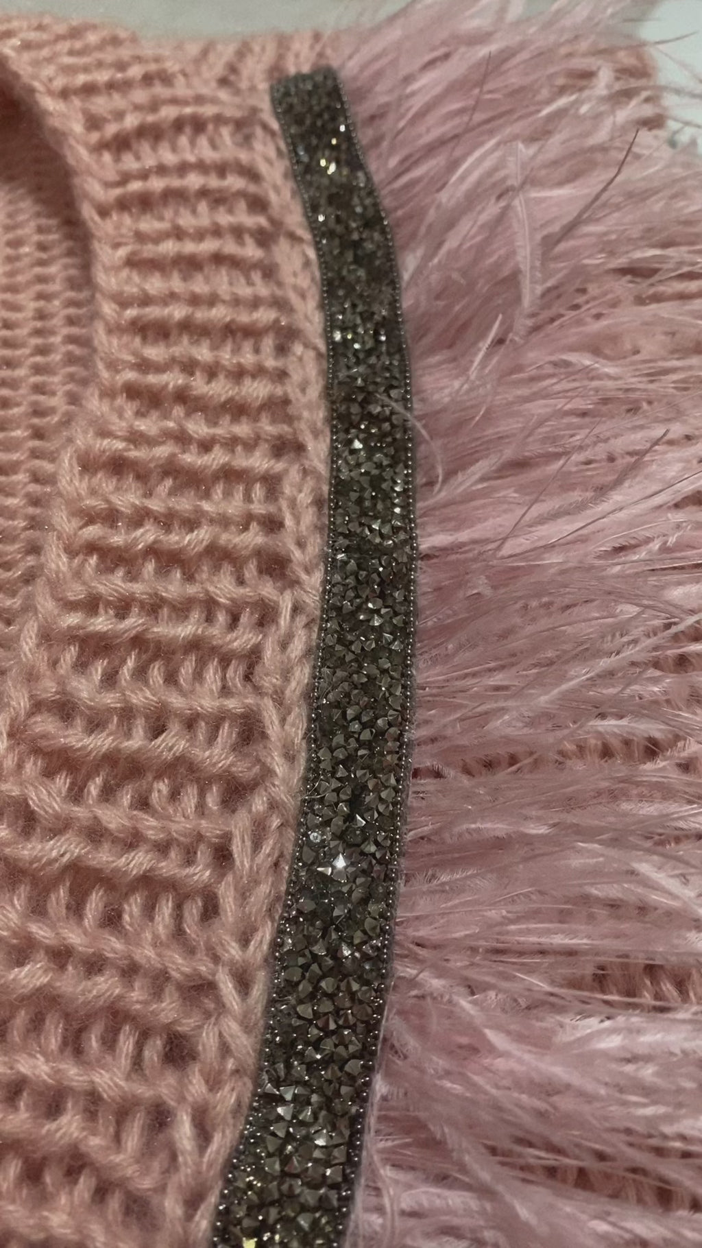 Pink vest with feathers