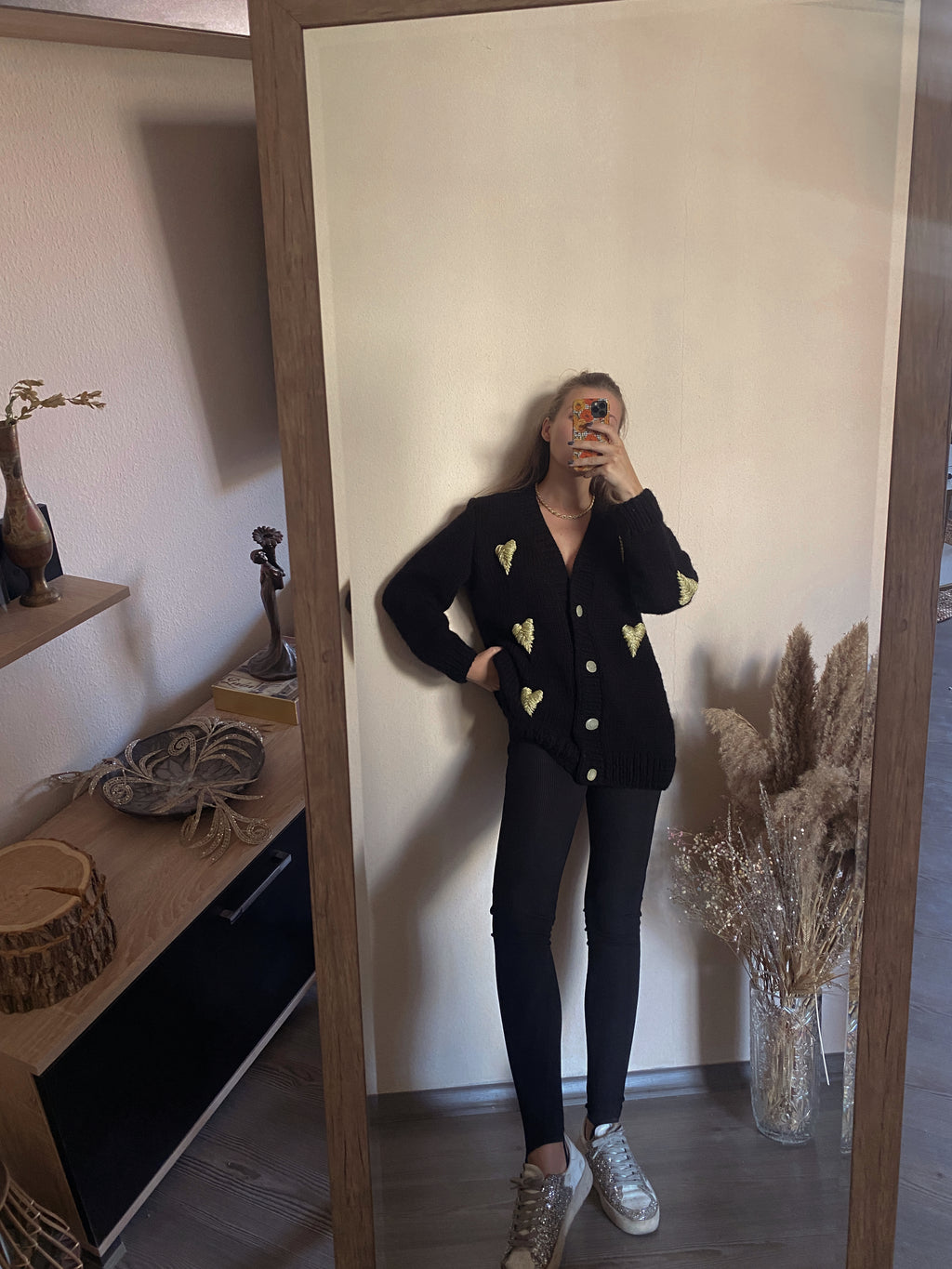 Black cardigan with golden hearts