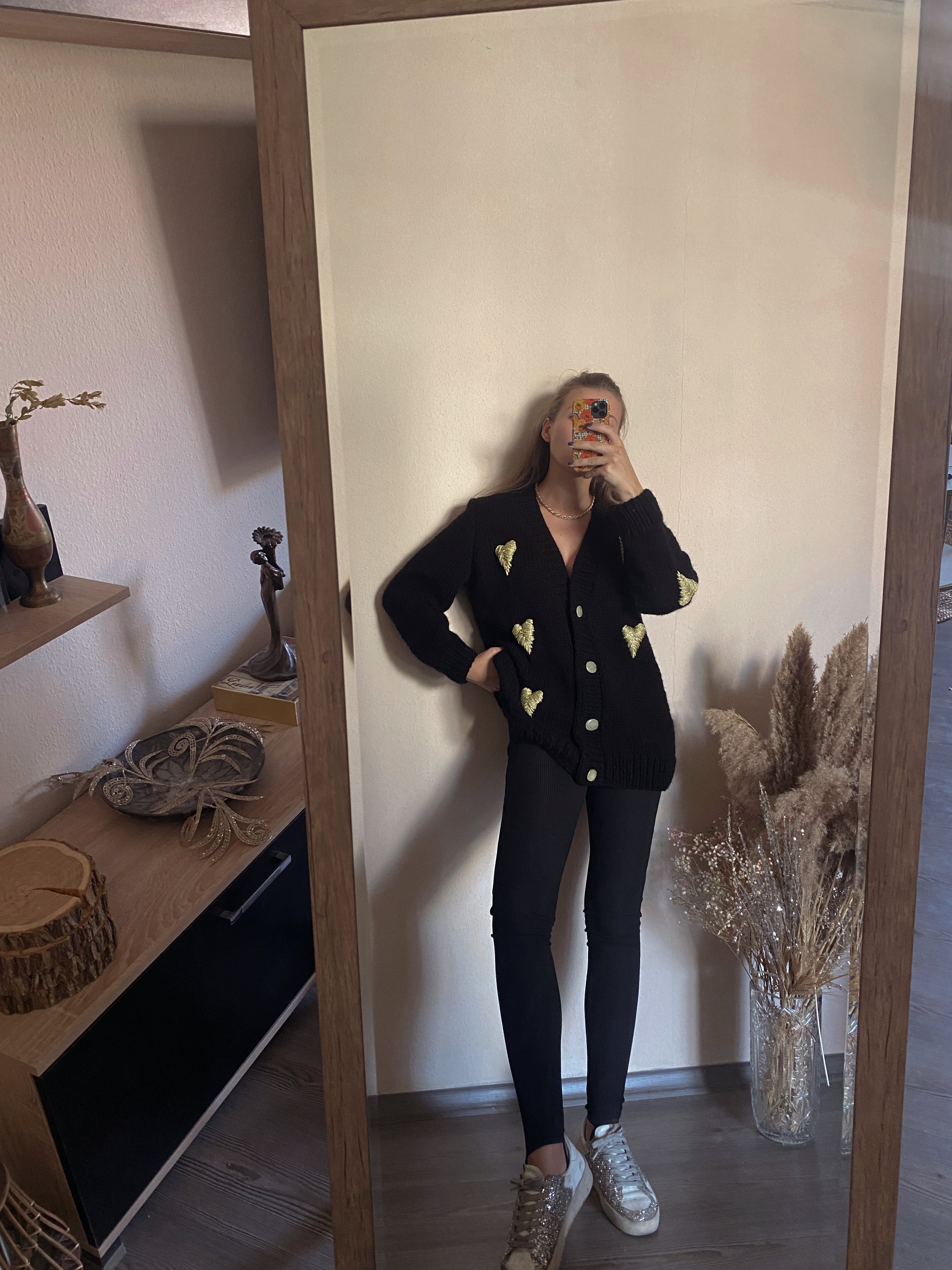 Black cardigan with golden hearts