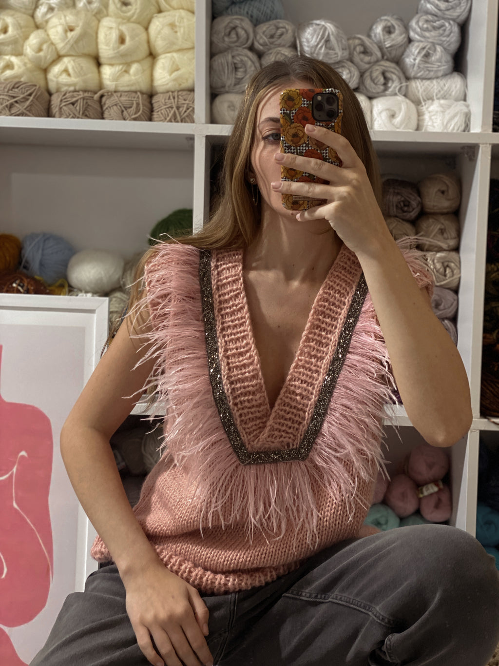 Pink vest with feathers