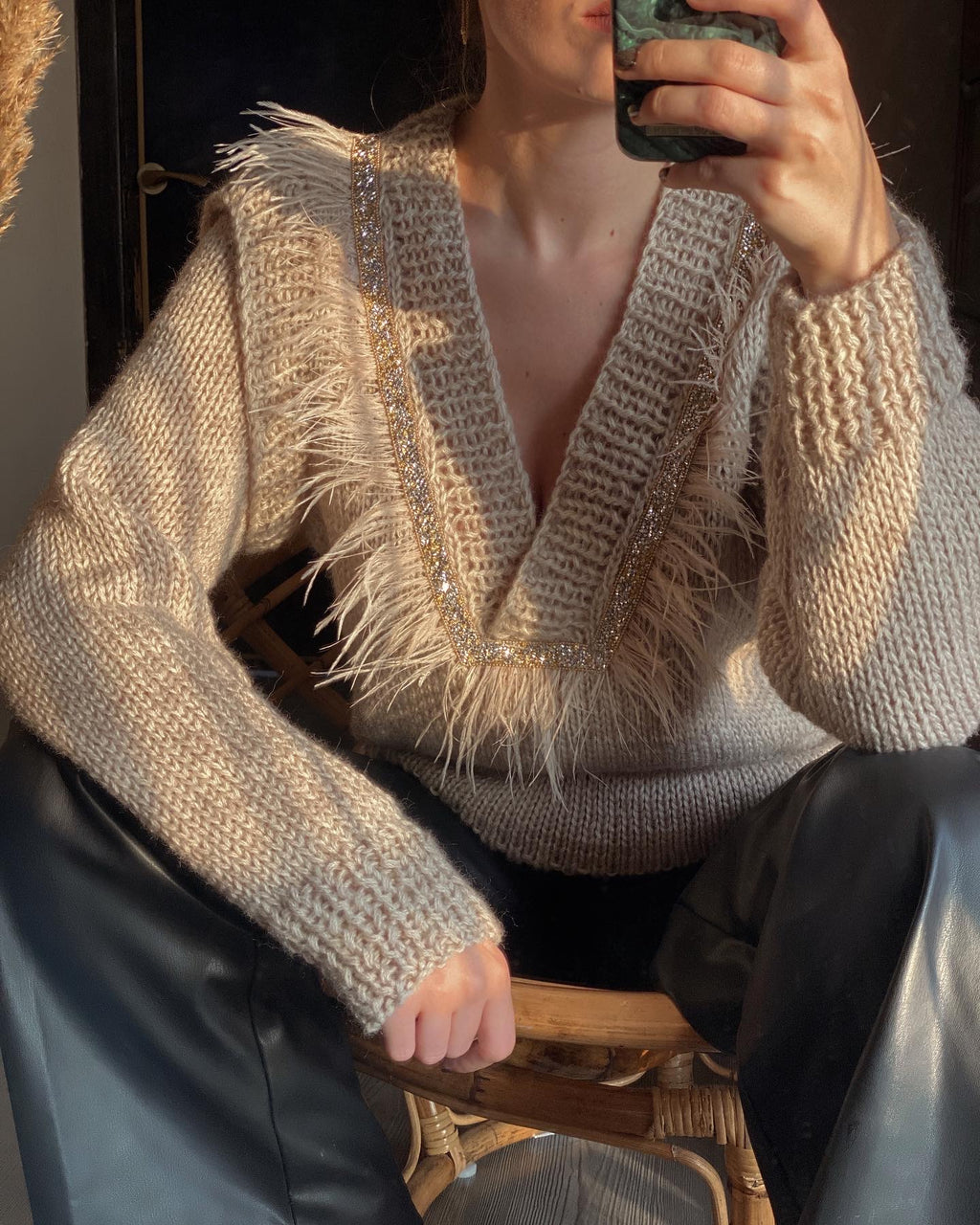 Sweaters with feathers