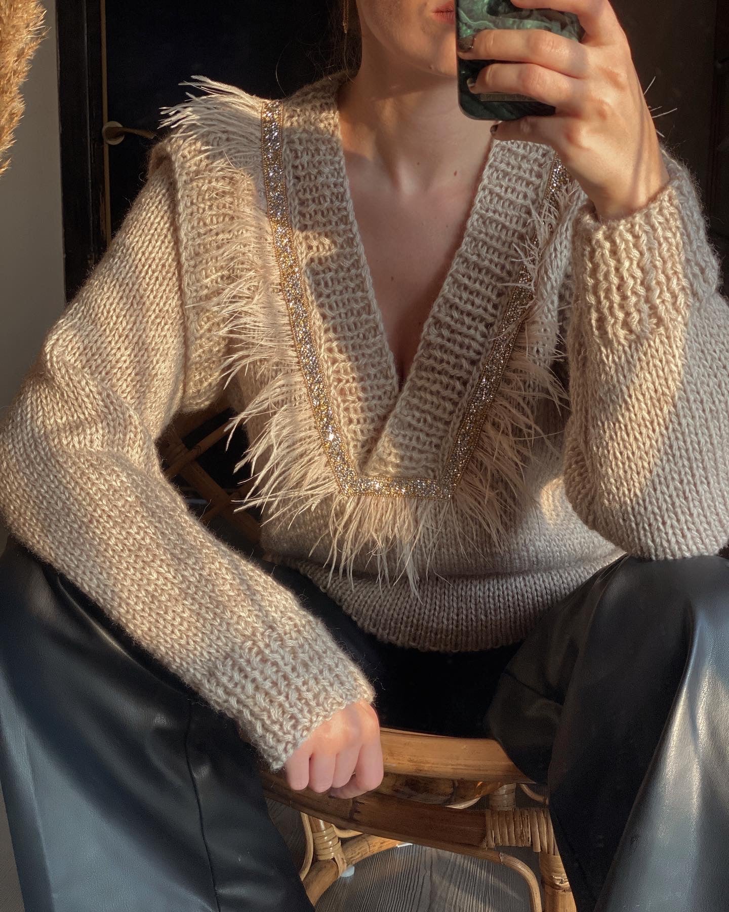 Sweaters with feathers