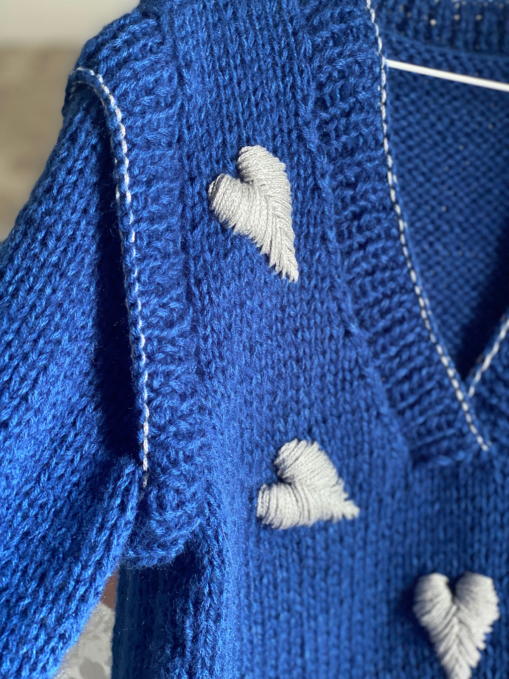 Blue wool sweater with hearts