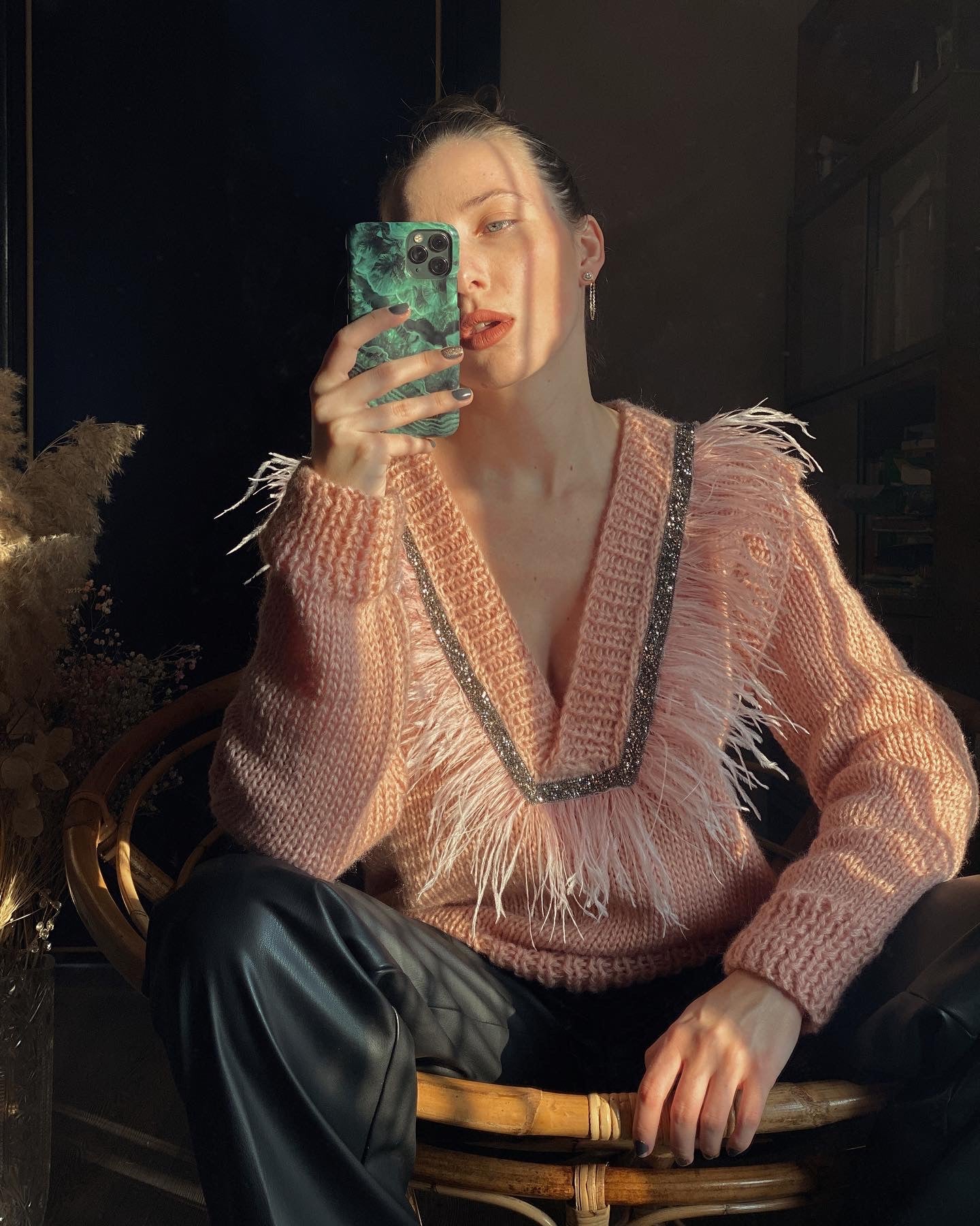 Sweaters with feathers