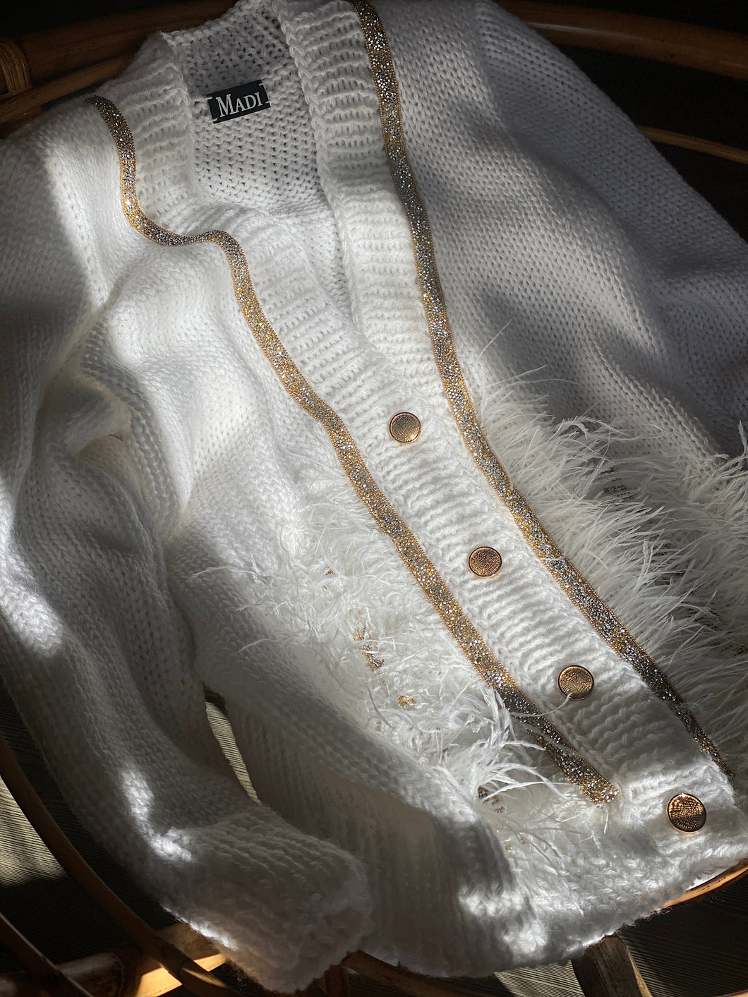 White cardigan with feathers