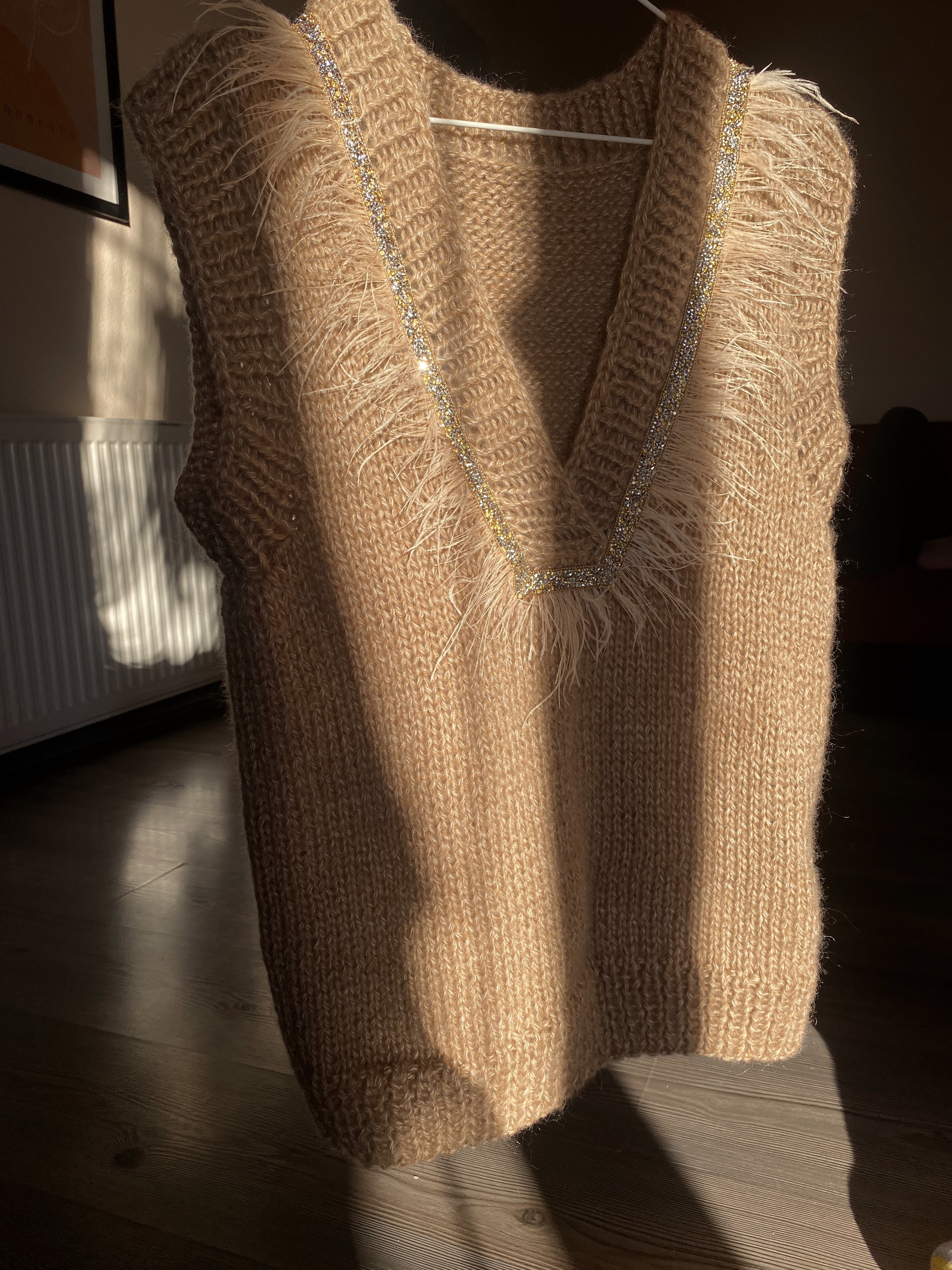 Brown vest with feathers