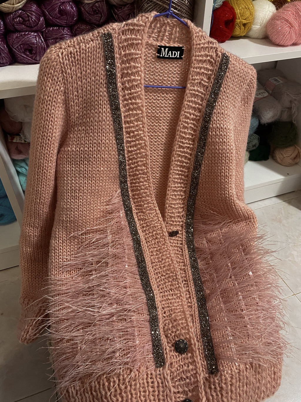Pink wool cardigan with feathers