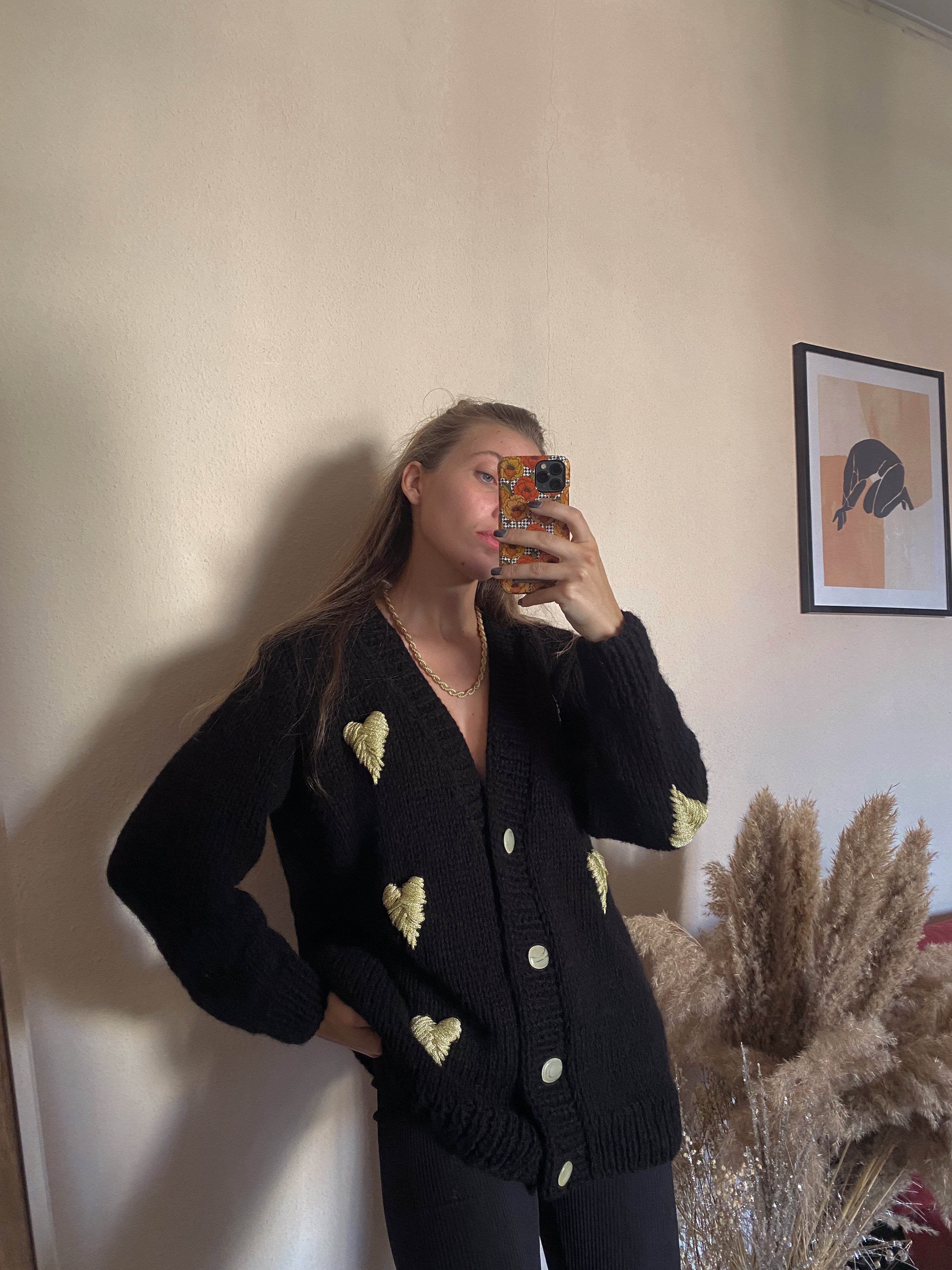 Black cardigan with golden hearts