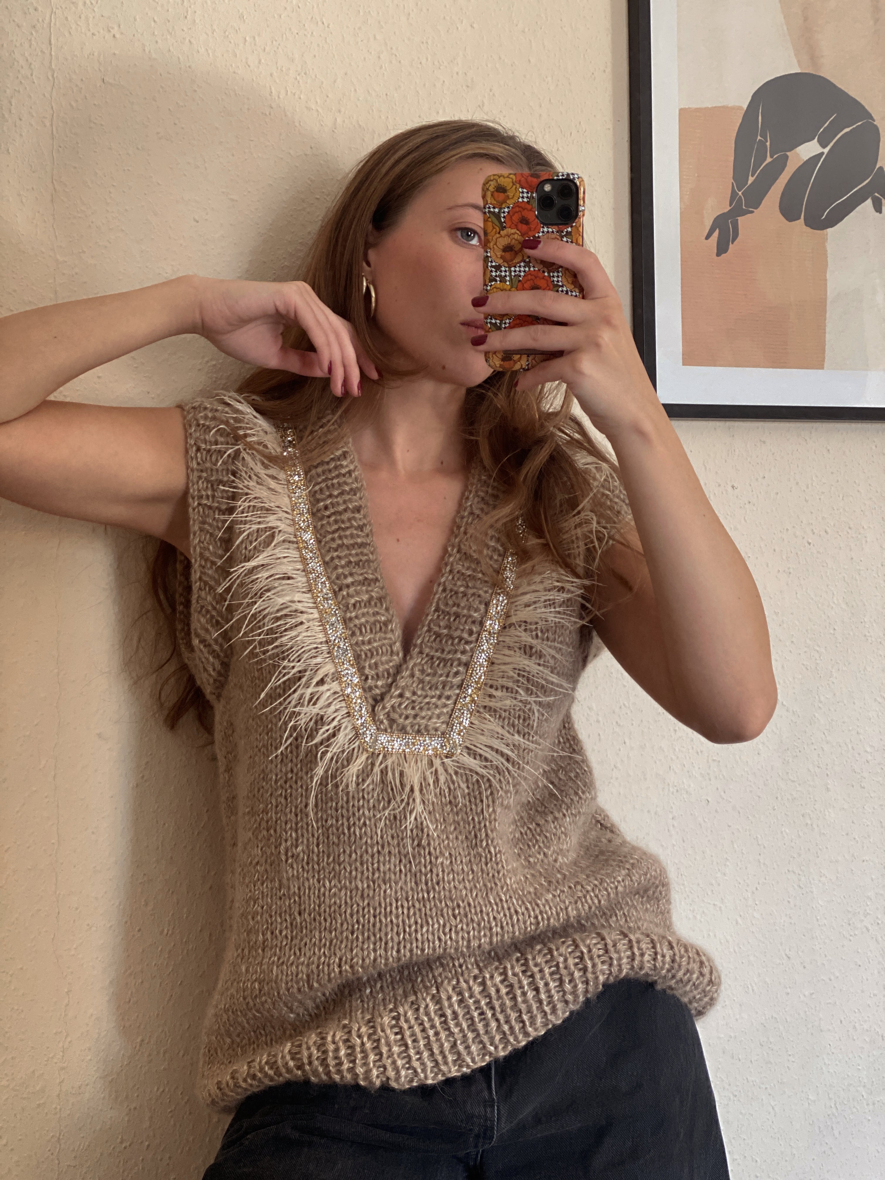 Brown vest with feathers