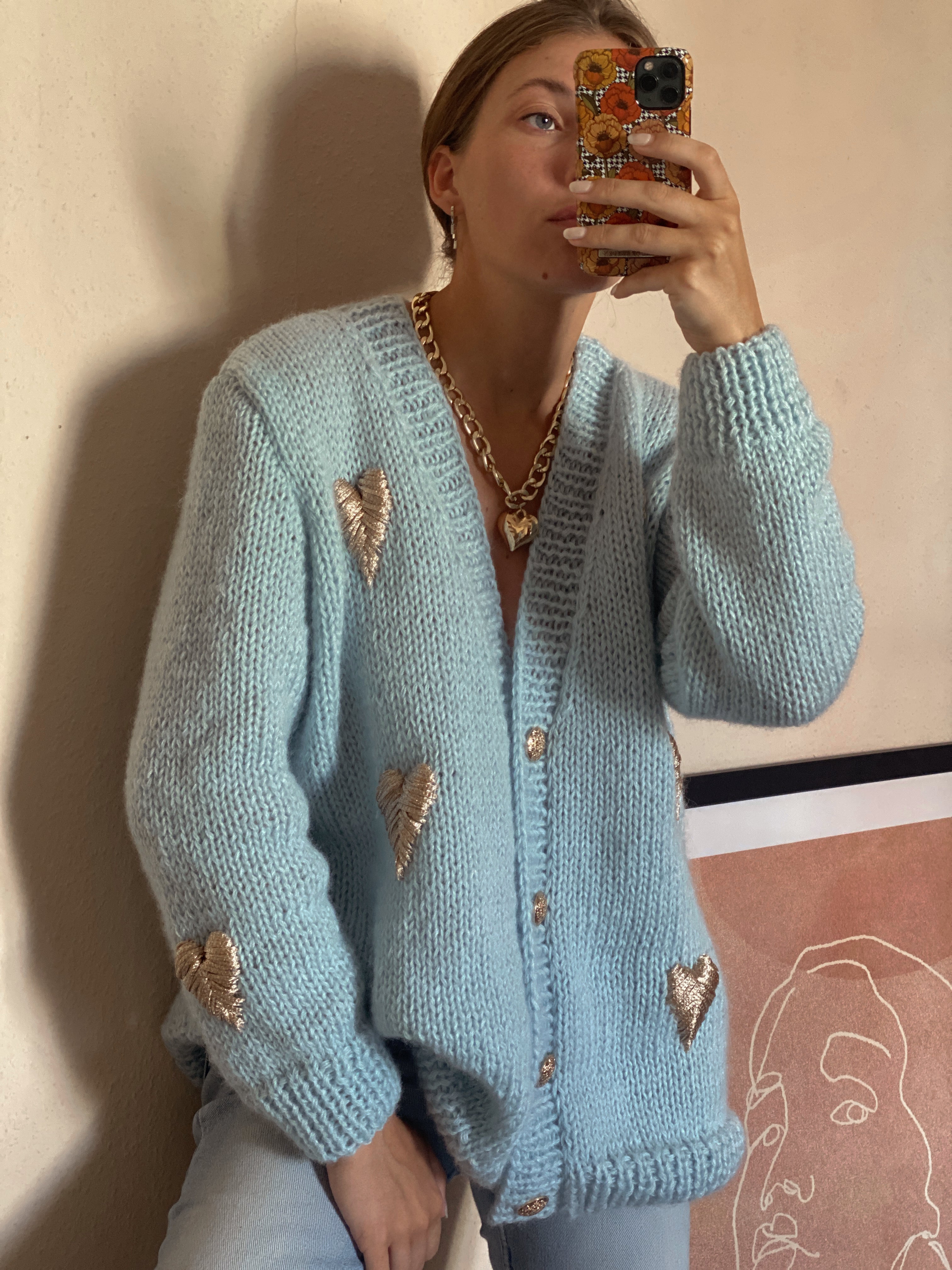 Blue cardigan with golden hearts
