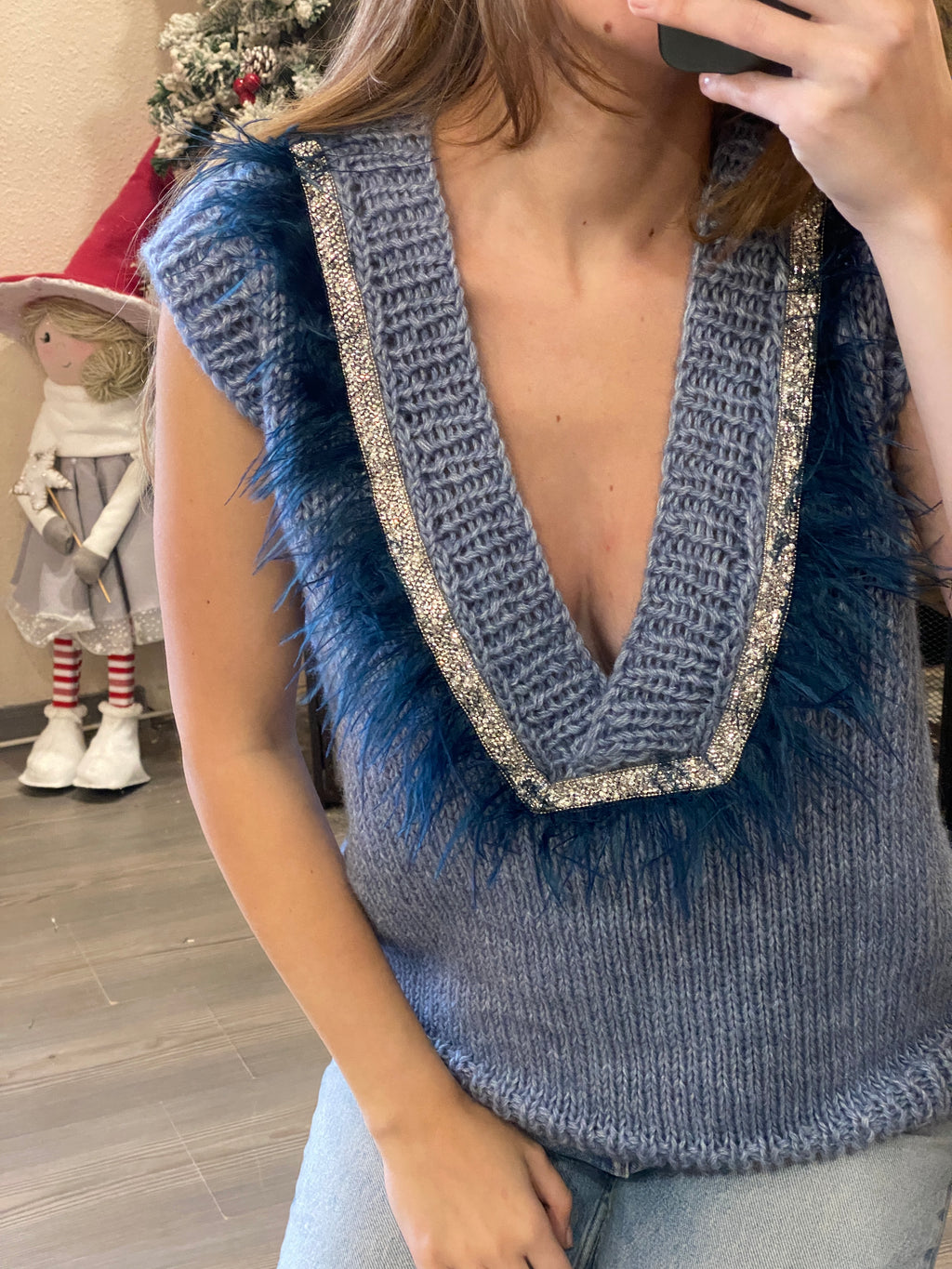 Brown vest with feathers