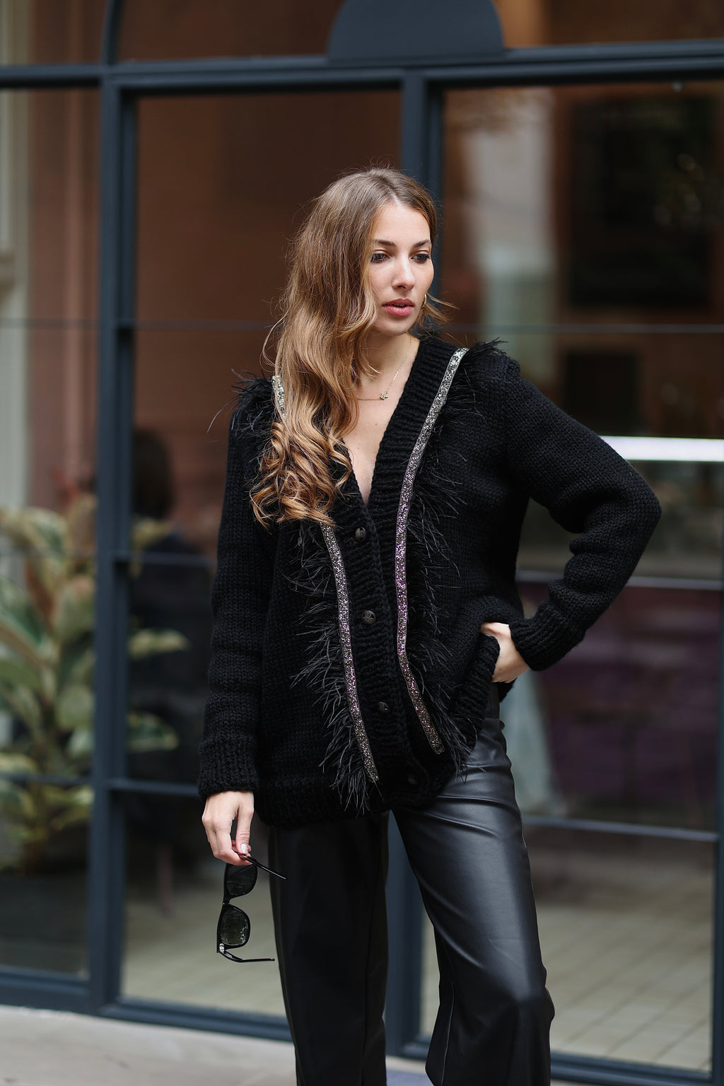 Black cardigan with feathers