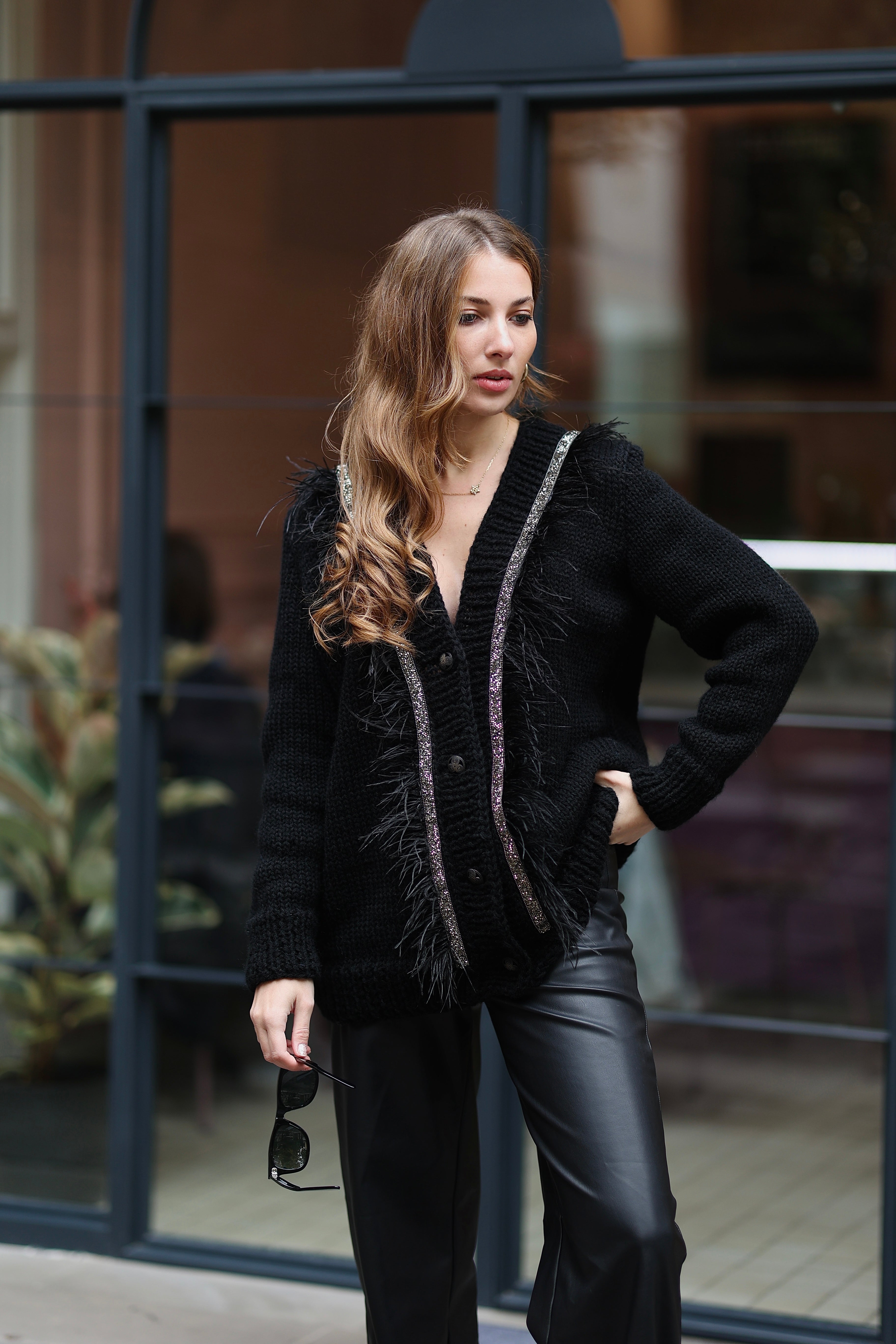 Black cardigan with feathers