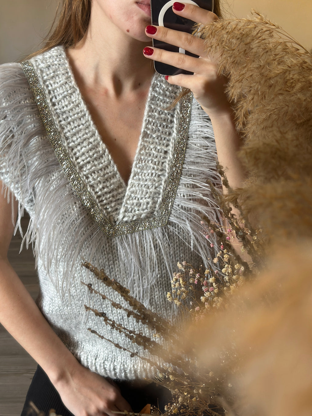 Brown vest with feathers