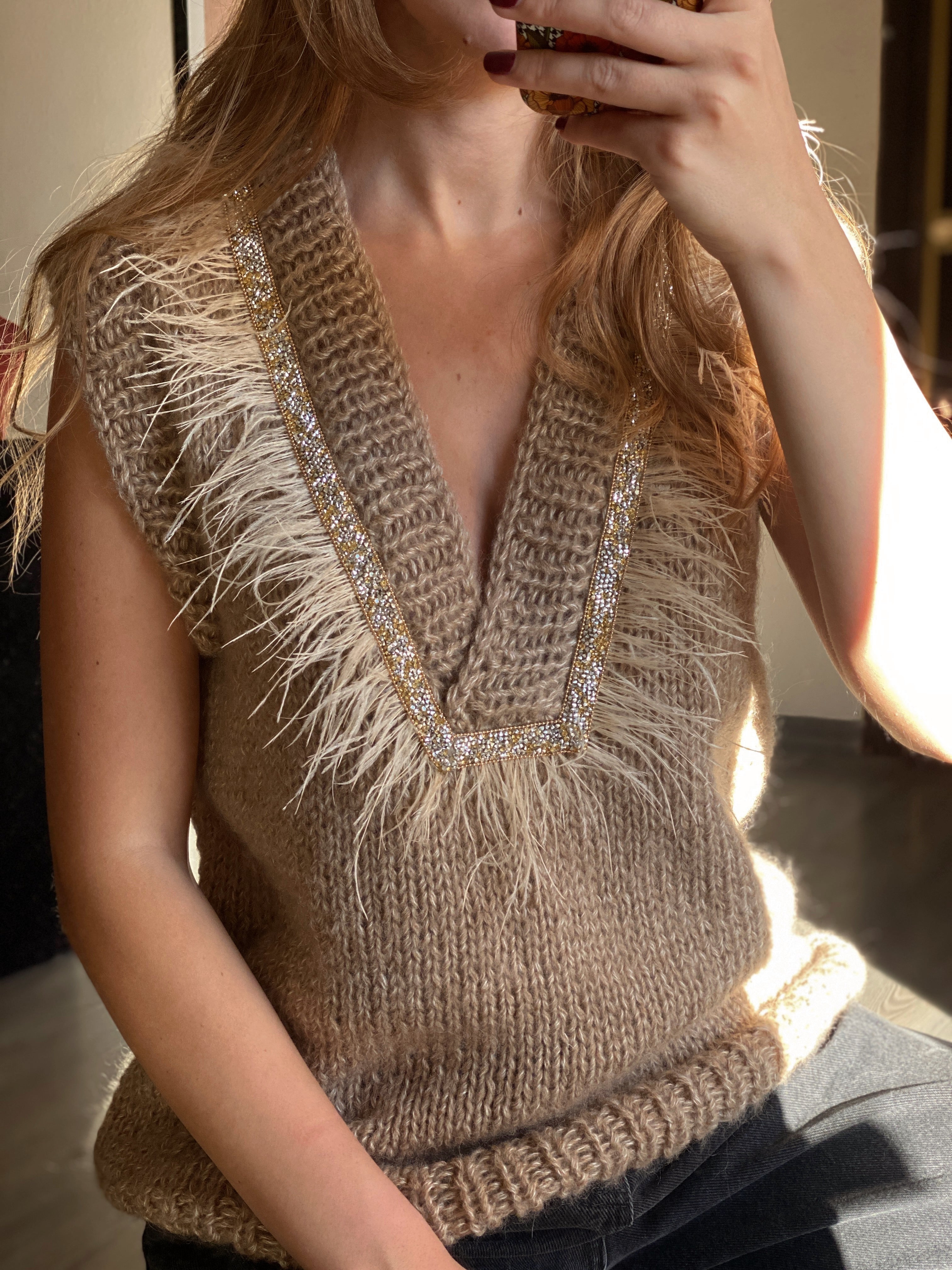 Brown vest with feathers