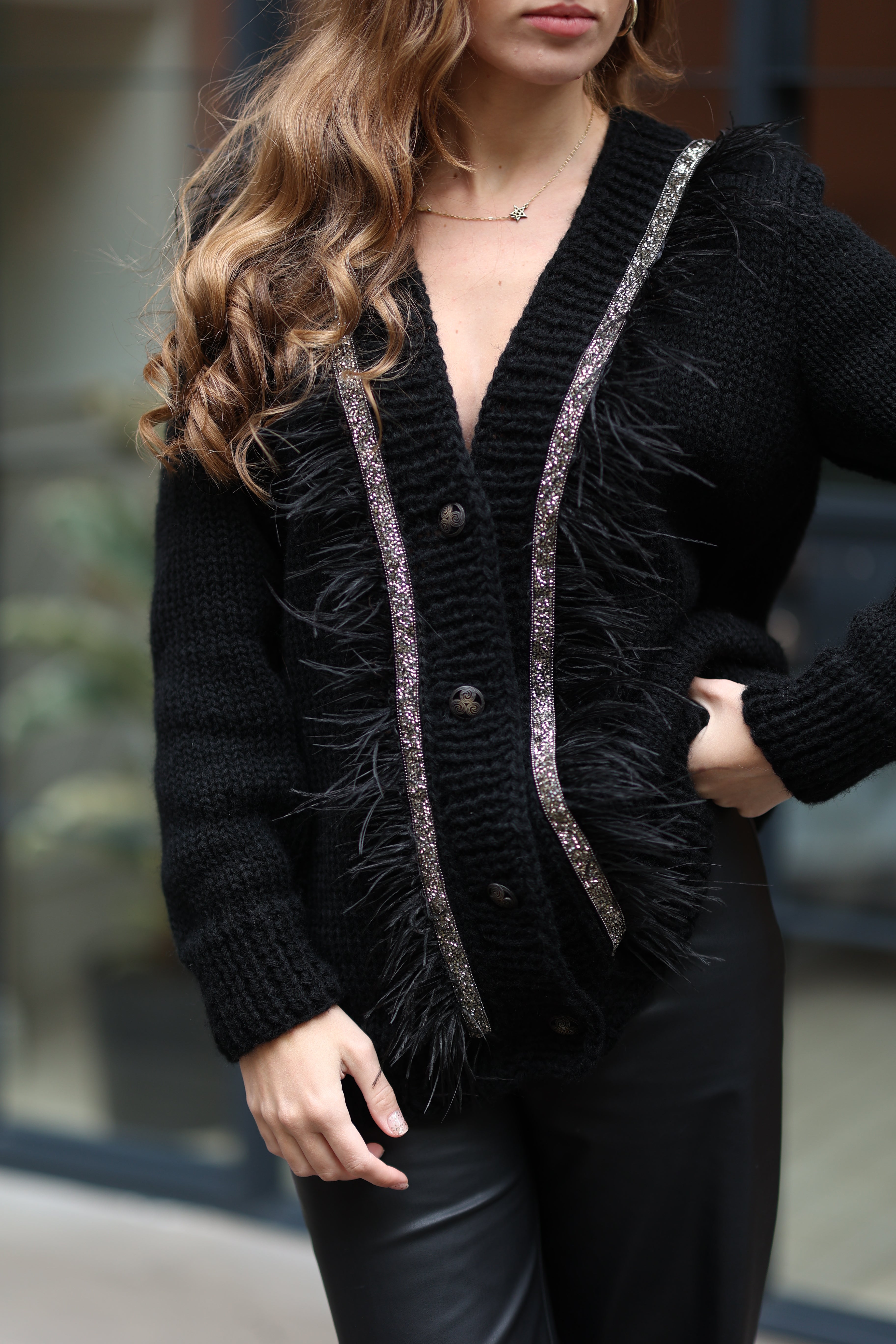 Black cardigan with feathers