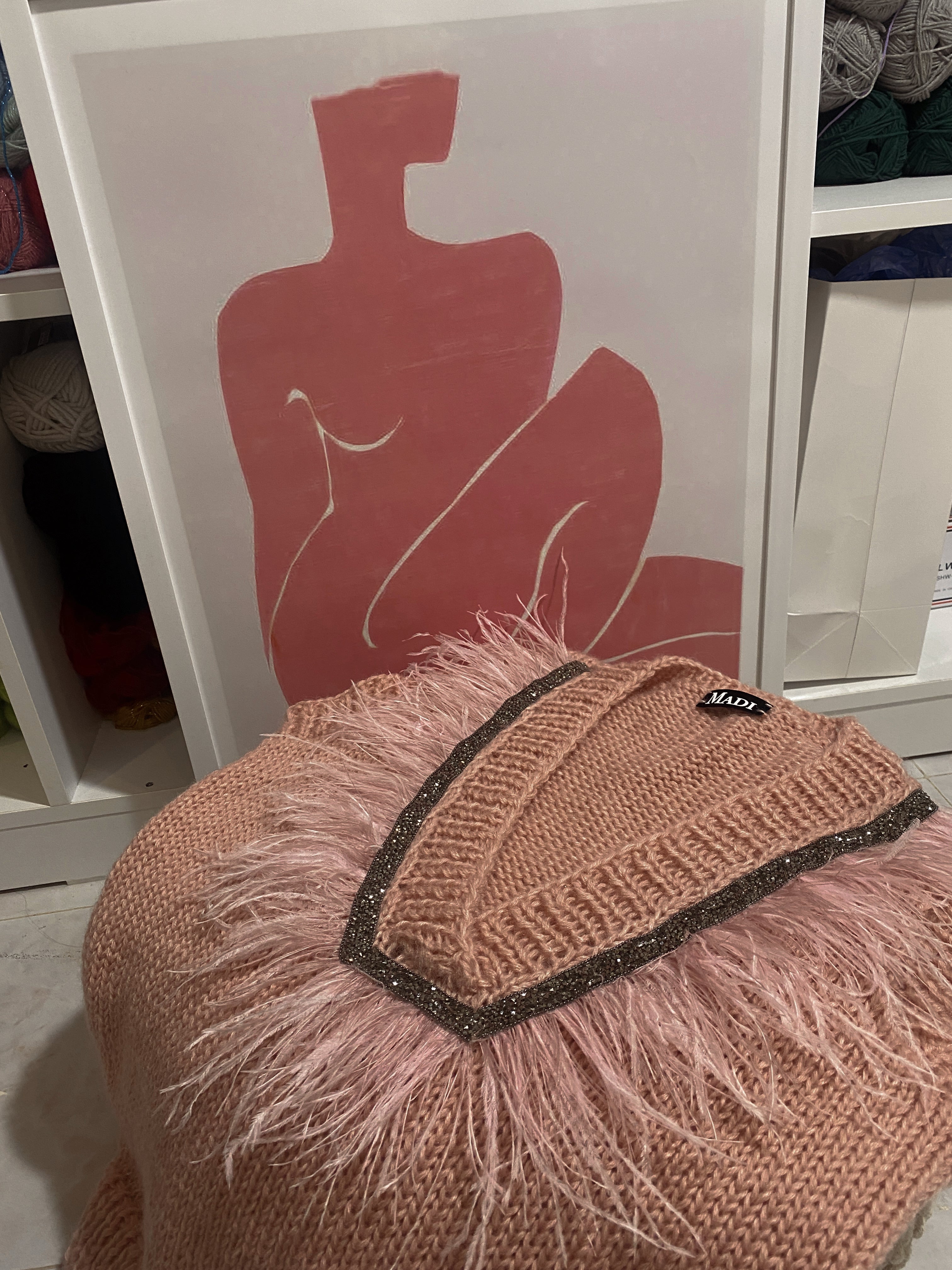 Pink vest with feathers