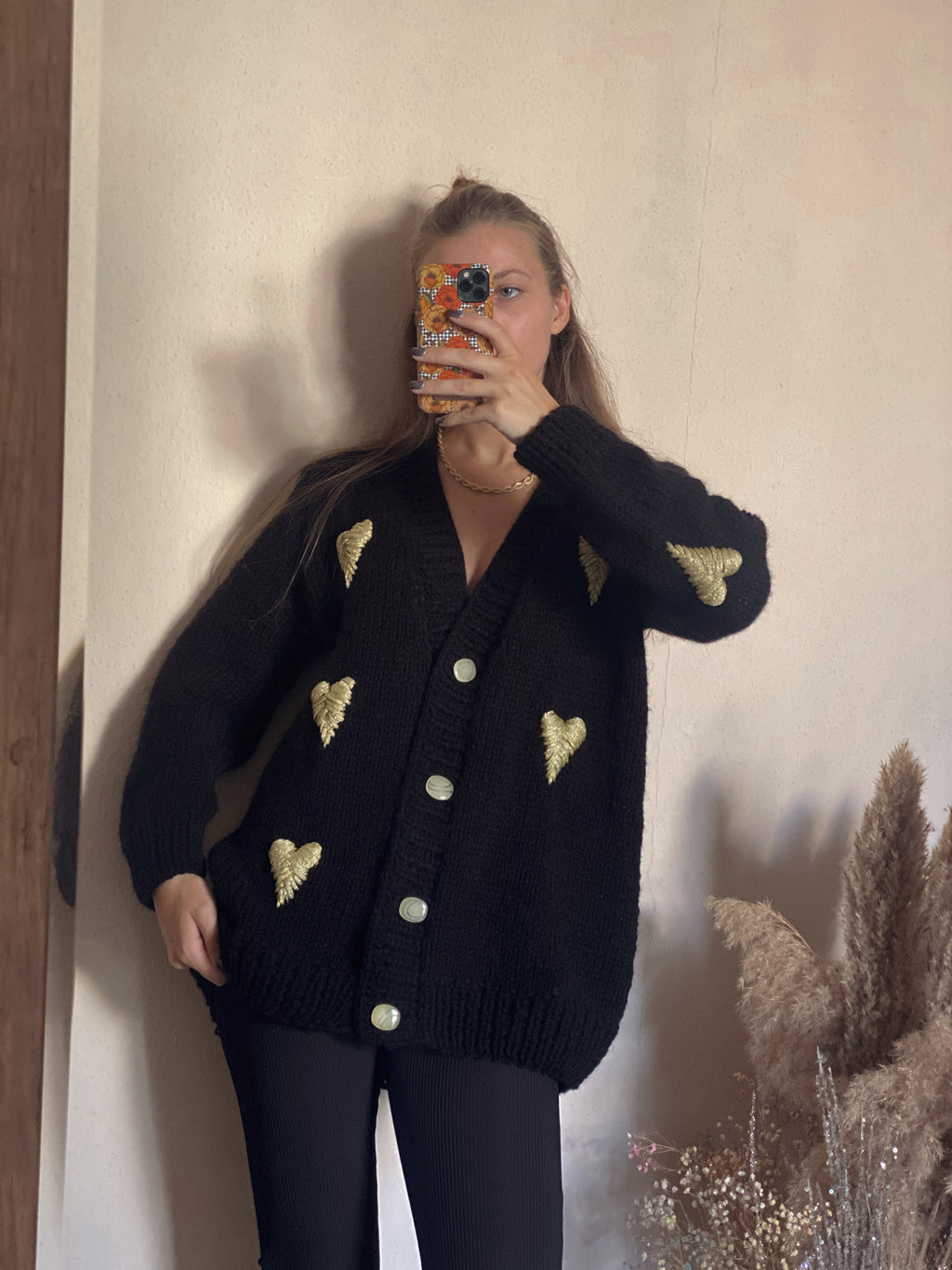 Black cardigan with golden hearts
