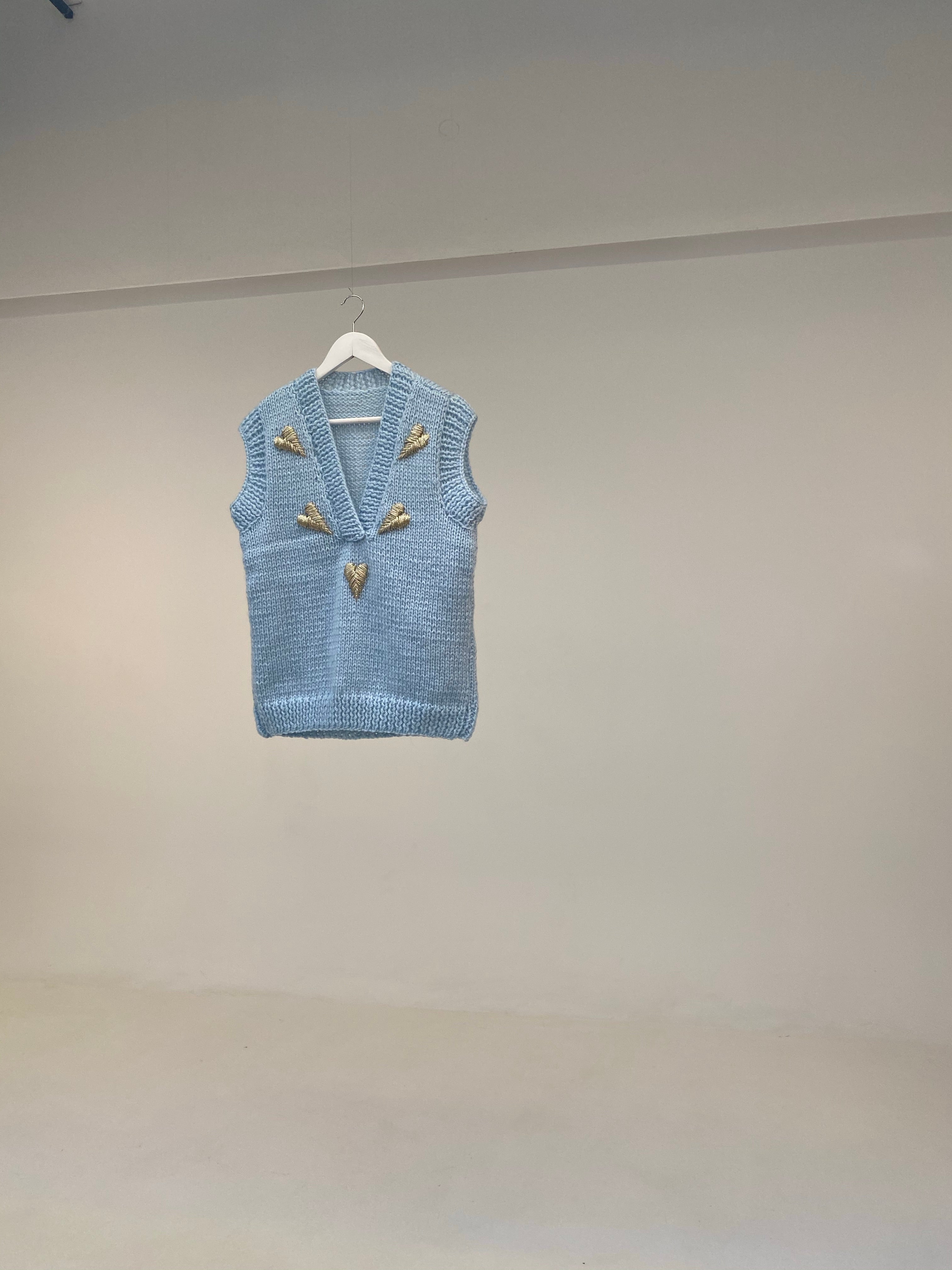Light blue vest with hearts