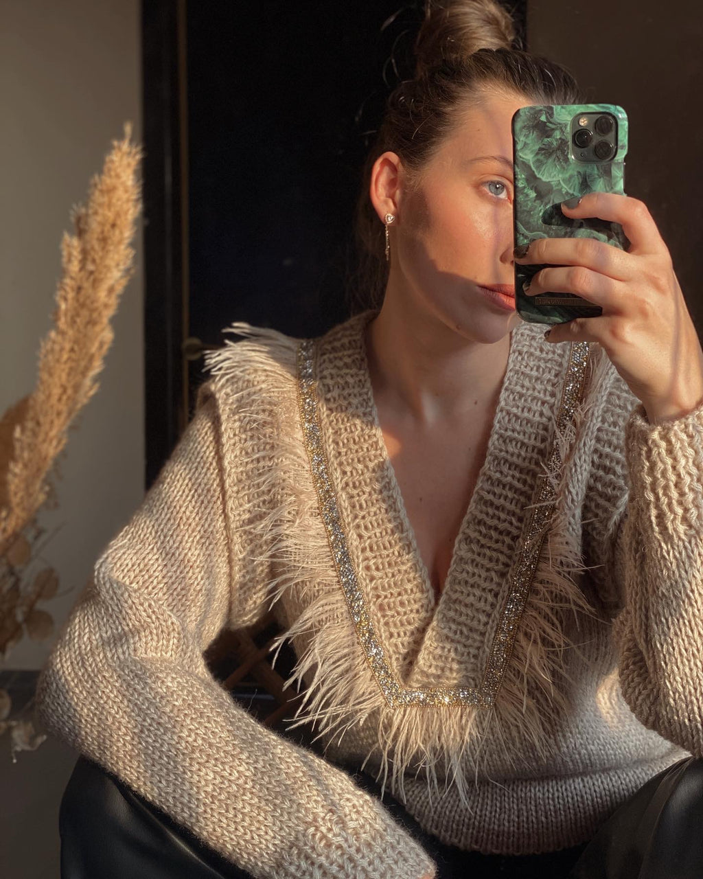 Sweaters with feathers