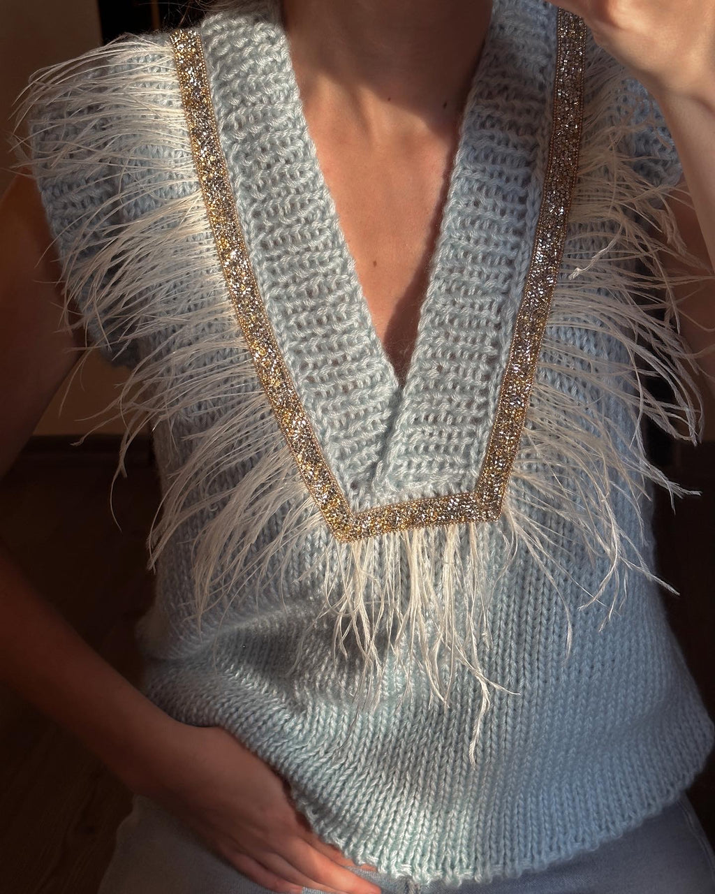 Brown vest with feathers