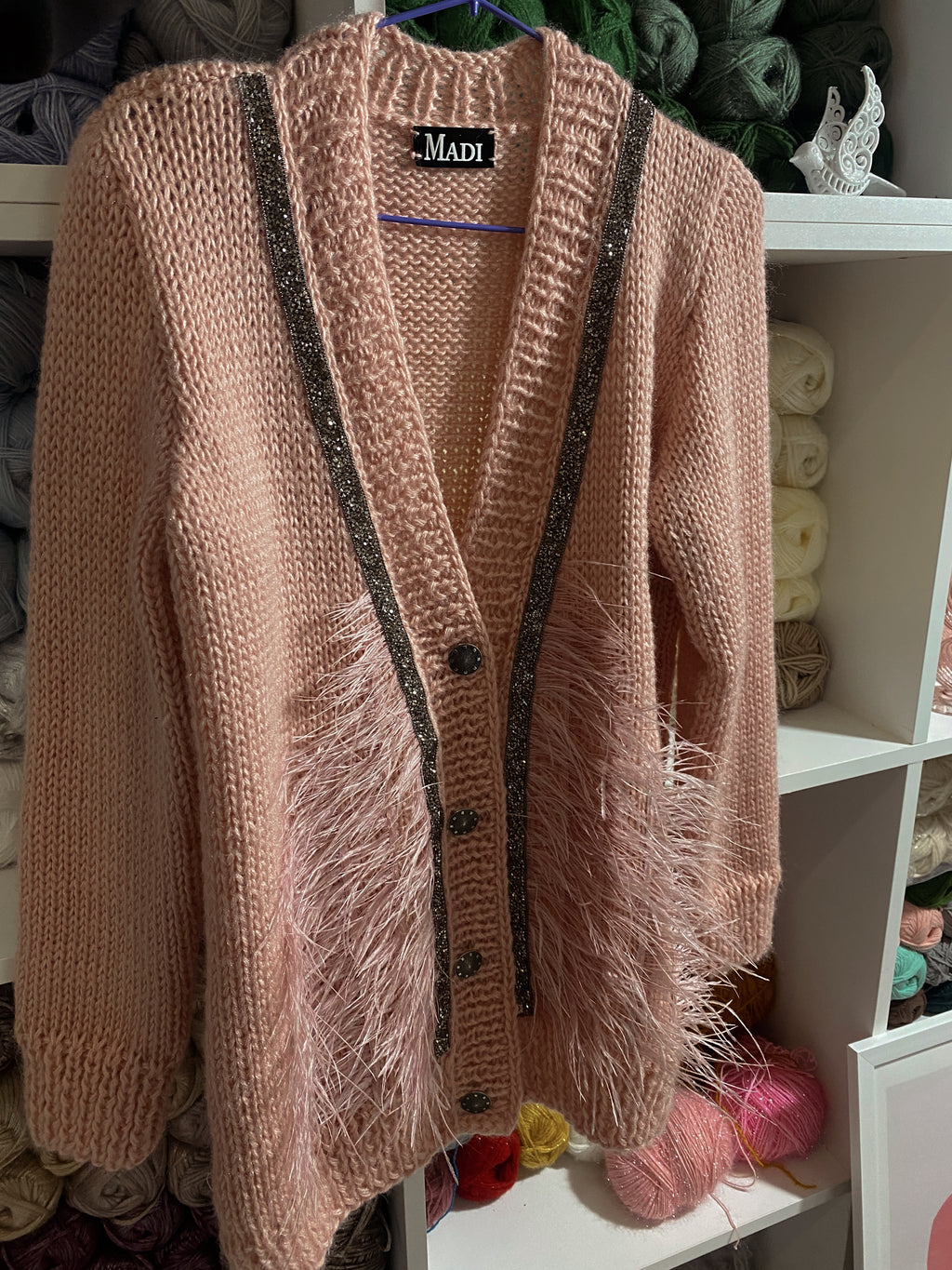 Pink wool cardigan with feathers