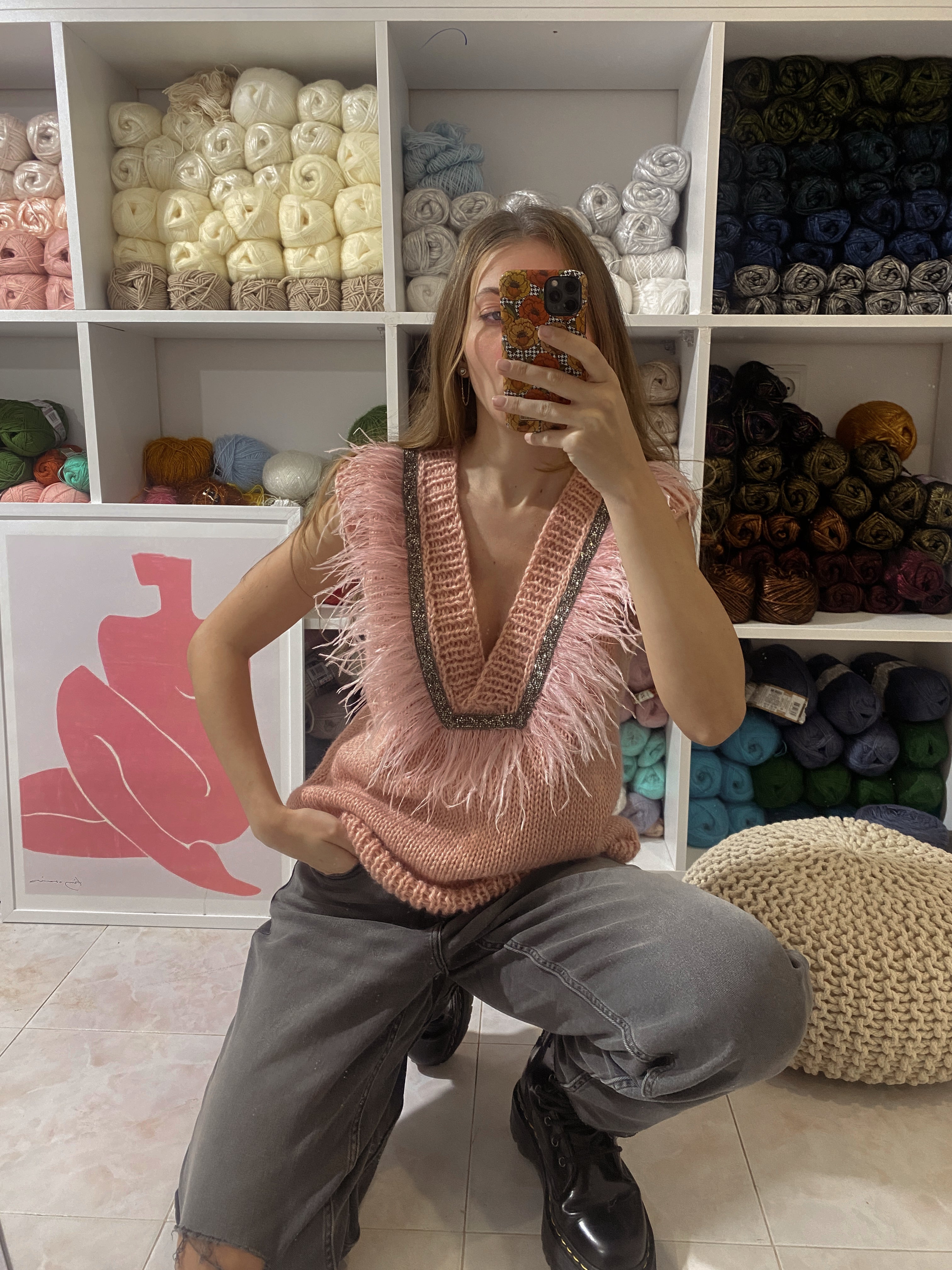 Pink vest with feathers