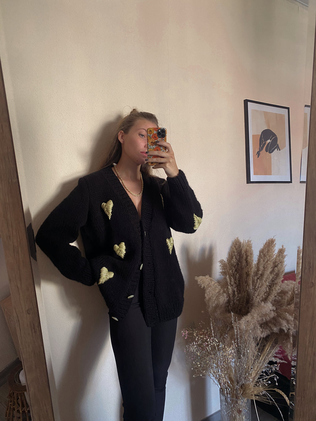 Black cardigan with golden hearts