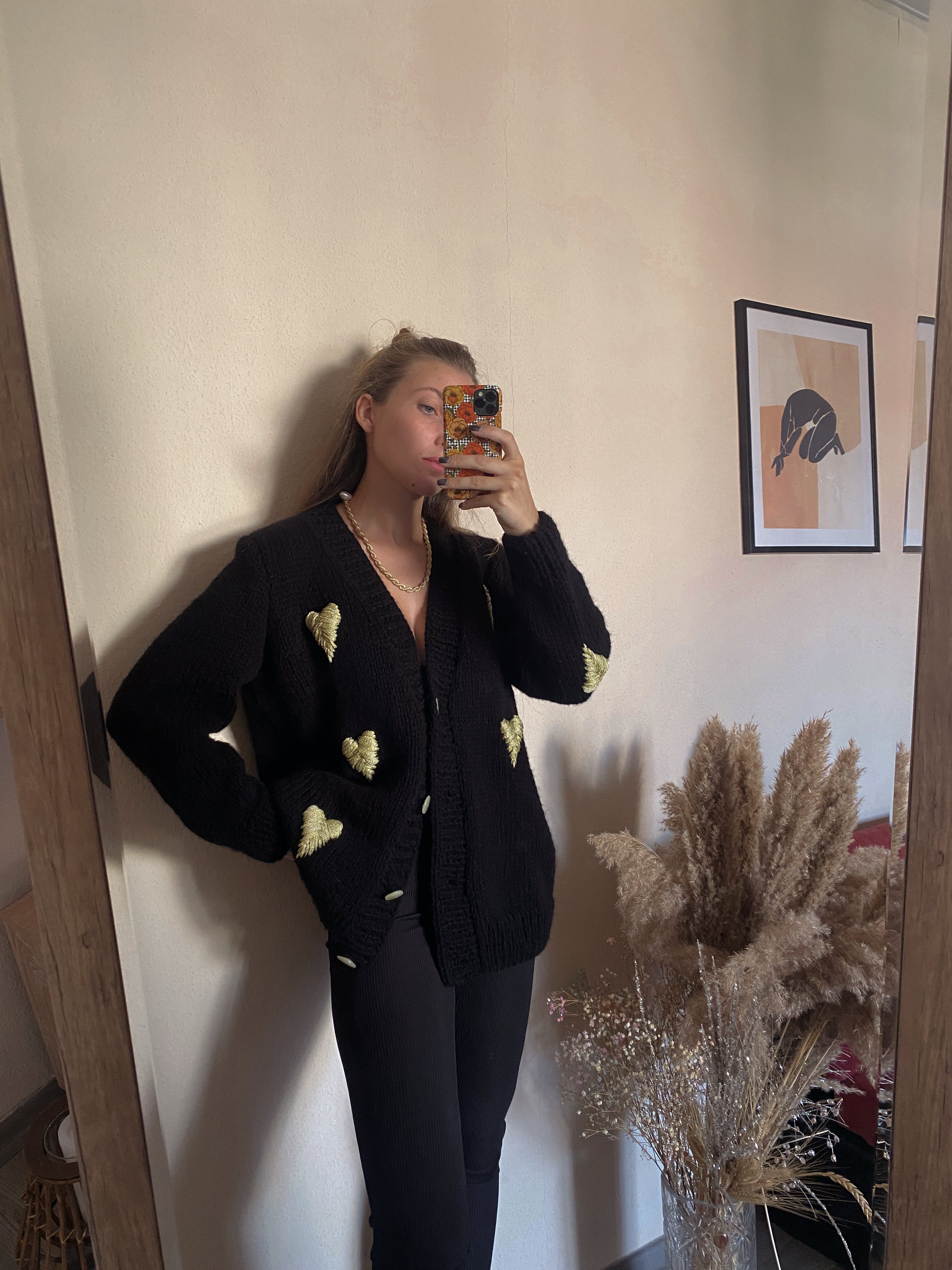 Black cardigan with golden hearts