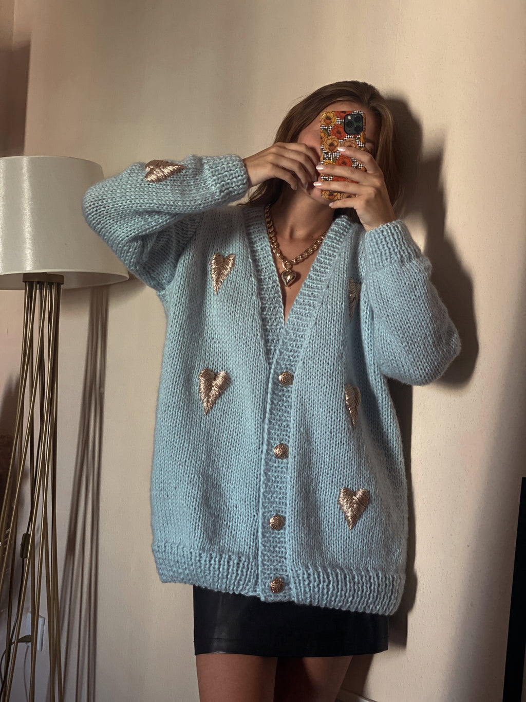 Blue cardigan with golden hearts