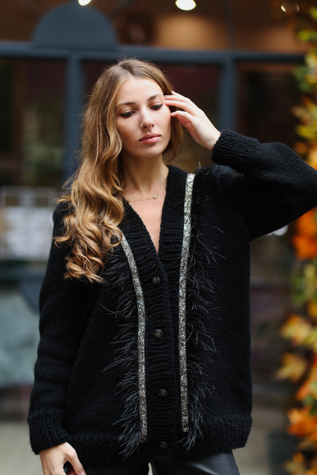Black cardigan with feathers