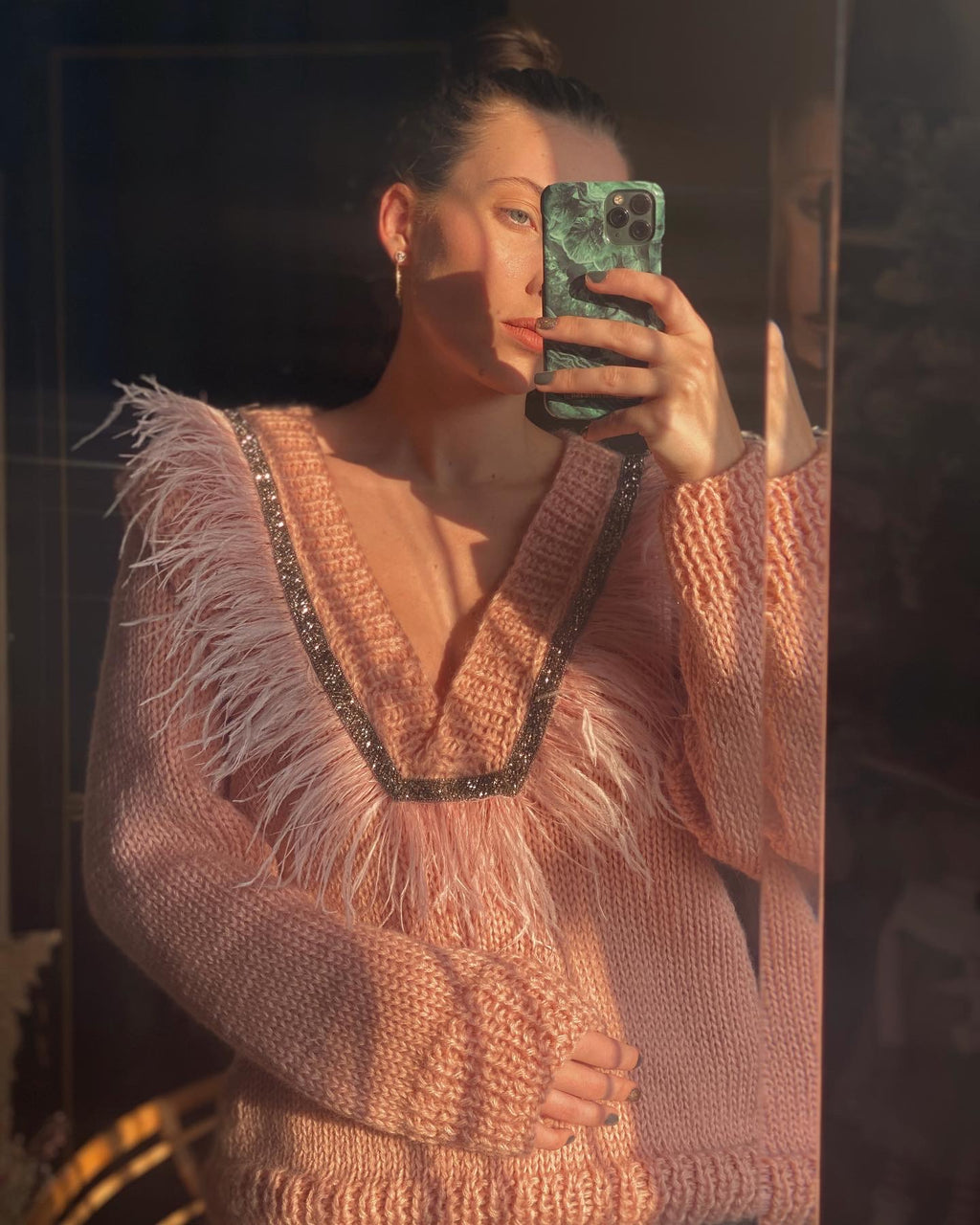 Sweaters with feathers