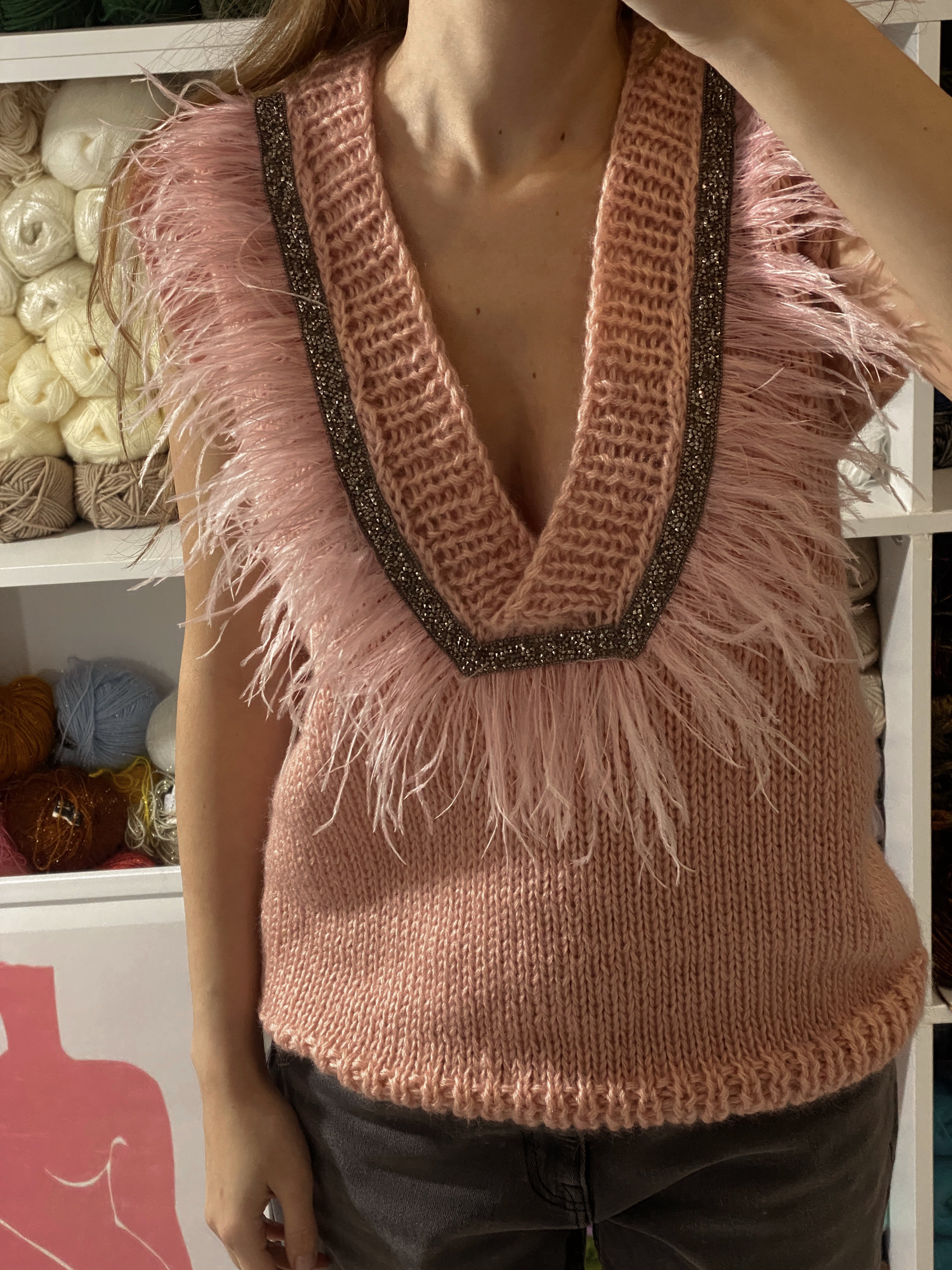 Pink vest with feathers
