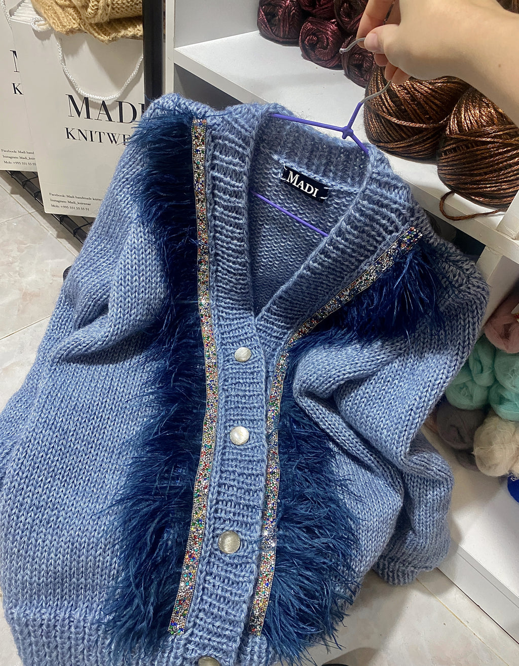 Blue jeans cardigan with feathers